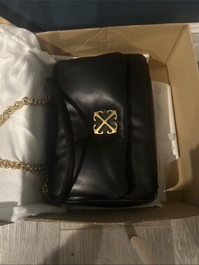 Black Leather Shoulder Bag with Gold Hardware.   Off white